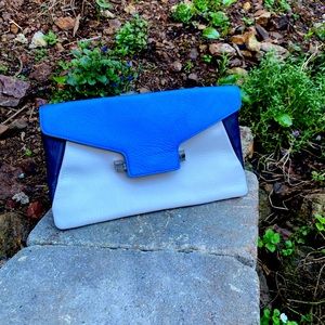 Vince Camuto clutch. Soft leather. Dove Grey with Navy/Blue. In great condition.